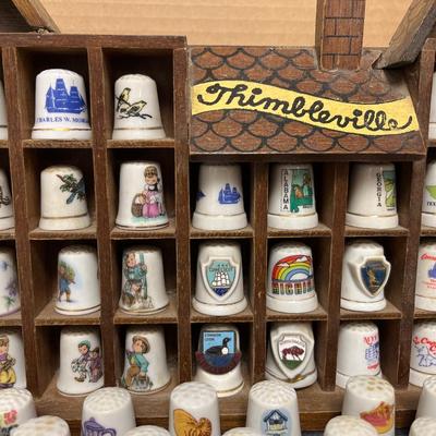 Sale Photo Thumbnail #138: Entire thimble collection and Thimbleville display