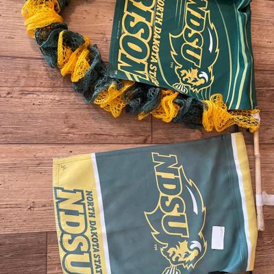 NDSU flags with ice like holder