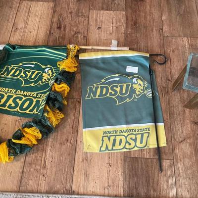 NDSU flags with ice like holder