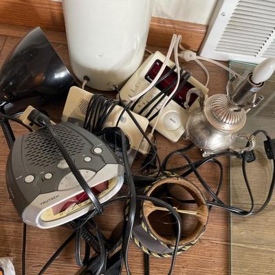 Bunch of alarm clocks and lamps