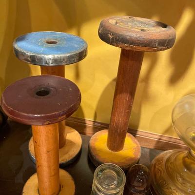 Vintage spools, oil lamp, and insulators