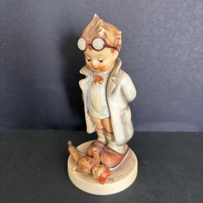 LOT 88: Hummel Figurines: Sister, The Doctor (127) & Happy Traveler