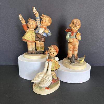 LOT 89: Hummel Figurines: Bird Watching, Goose Girl and Good-bye
