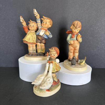 LOT 89: Hummel Figurines: Bird Watching, Goose Girl and Good-bye