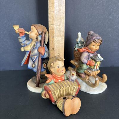 LOT 91: Hummel Figurines: Hear Ye Hear Ye, Let's Sing & Ride into Christmas