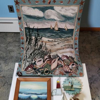 LOT 117: Collection of Beach Themed Artwork and Decorations Including Painted Lighthouse Clock, Wall Tapestry and More