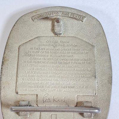LOT 159: Kershaw 70th Anniversary Knives Serial No. E 1504 and E 9929, Sheaths and Pewter Pete Kershaw Numbered Belt Buckle