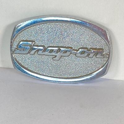 LOT 196: Pair of Snap-on Belt Buckles - Charging to New Horizons (Solid Brass) and Snap-on (Chrome on Solid Brass)