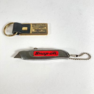 LOT 199: Snap-on Tools "The Master's Choice" Brass Tire Gauge, 70th Anniversary Key Chain and Miniature Utility Knife