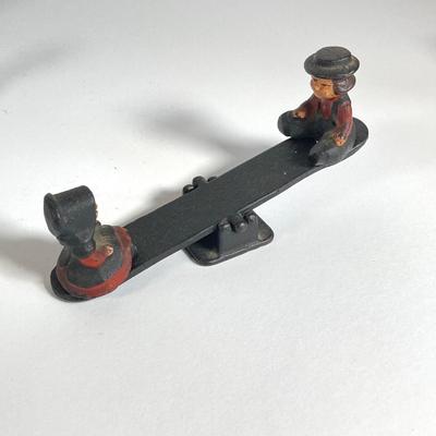 LOT 203: Collection of Cast Iron Miniatures - Salt and Pepper, Seesaw,, Sand Timer, Anvil, Tonka Toy Fire Hydrant, Skillet, Hammer and More