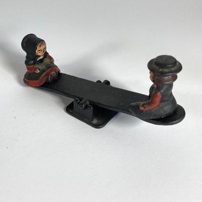 LOT 203: Collection of Cast Iron Miniatures - Salt and Pepper, Seesaw,, Sand Timer, Anvil, Tonka Toy Fire Hydrant, Skillet, Hammer and More
