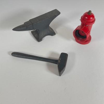 LOT 203: Collection of Cast Iron Miniatures - Salt and Pepper, Seesaw,, Sand Timer, Anvil, Tonka Toy Fire Hydrant, Skillet, Hammer and More