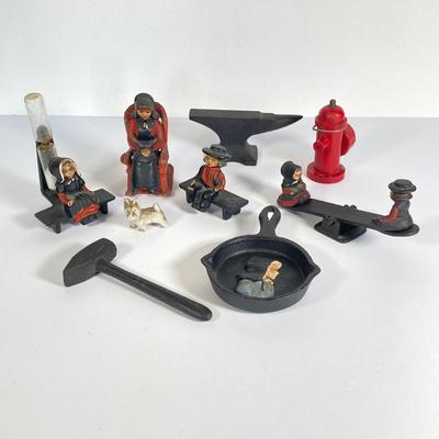 LOT 203: Collection of Cast Iron Miniatures - Salt and Pepper, Seesaw,, Sand Timer, Anvil, Tonka Toy Fire Hydrant, Skillet, Hammer and More