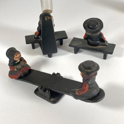 LOT 203: Collection of Cast Iron Miniatures - Salt and Pepper, Seesaw,, Sand Timer, Anvil, Tonka Toy Fire Hydrant, Skillet, Hammer and More
