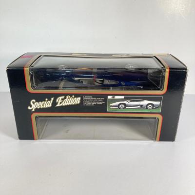 LOT 204: Collectible Diecast Cars - 1957 Chevrolet Corvette and Maisto 1992 Jaguar XJ220 in Original Box