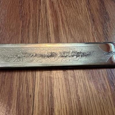 SWORD WITH AN ENGRAVED BLADE