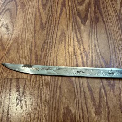 SWORD WITH AN ENGRAVED BLADE