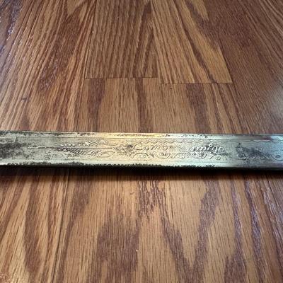 SWORD WITH AN ENGRAVED BLADE