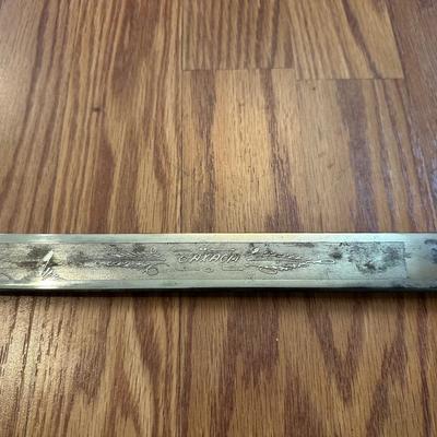 SWORD WITH AN ENGRAVED BLADE