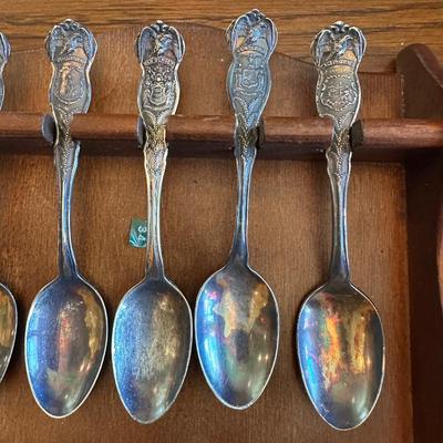 SOUVENIR SPOONS AND A WALL HUNG HOLDER