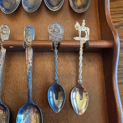 SOUVENIR SPOONS AND A WALL HUNG HOLDER