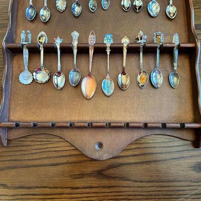 SOUVENIR SPOONS AND A WALL HUNG HOLDER