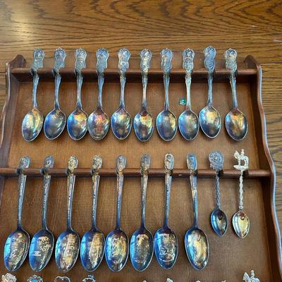 SOUVENIR SPOONS AND A WALL HUNG HOLDER