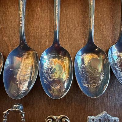 SOUVENIR SPOONS AND A WALL HUNG HOLDER
