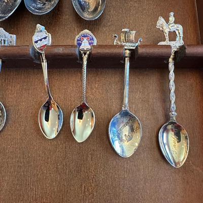 SOUVENIR SPOONS AND A WALL HUNG HOLDER