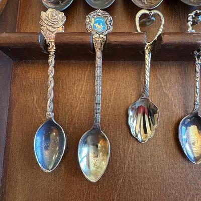 SOUVENIR SPOONS AND A WALL HUNG HOLDER