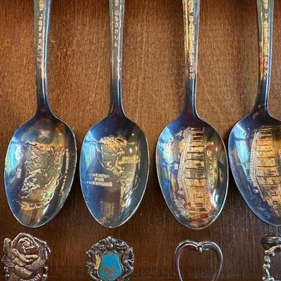 SOUVENIR SPOONS AND A WALL HUNG HOLDER