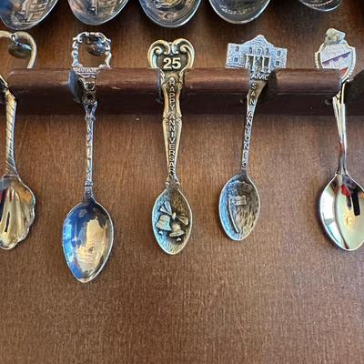 SOUVENIR SPOONS AND A WALL HUNG HOLDER