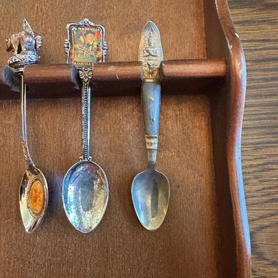 SOUVENIR SPOONS AND A WALL HUNG HOLDER