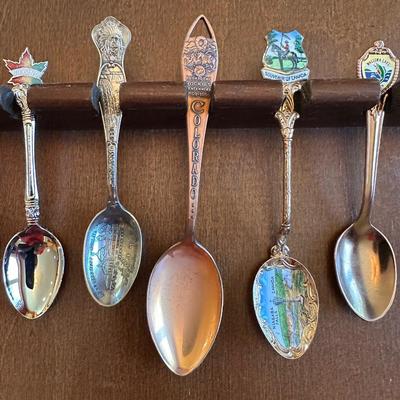 SOUVENIR SPOONS AND A WALL HUNG HOLDER