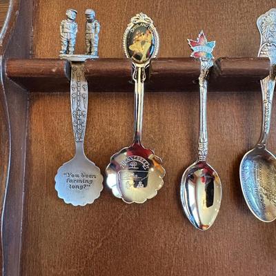 SOUVENIR SPOONS AND A WALL HUNG HOLDER