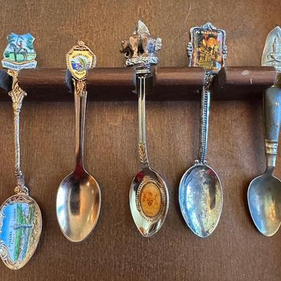 SOUVENIR SPOONS AND A WALL HUNG HOLDER