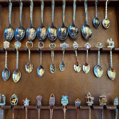SOUVENIR SPOONS AND A WALL HUNG HOLDER