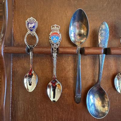 SOUVENIR SPOONS AND A WALL HUNG HOLDER