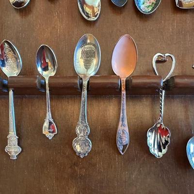 SOUVENIR SPOONS AND A WALL HUNG HOLDER