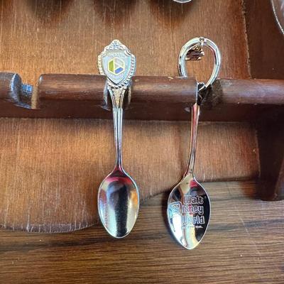 SOUVENIR SPOONS AND A WALL HUNG HOLDER