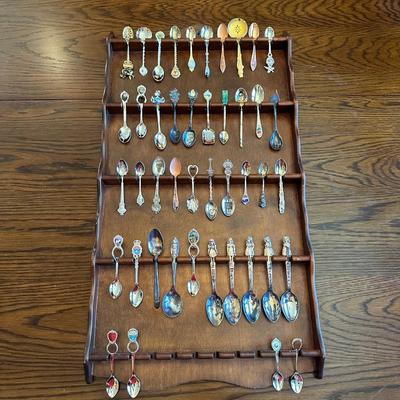 SOUVENIR SPOONS AND A WALL HUNG HOLDER