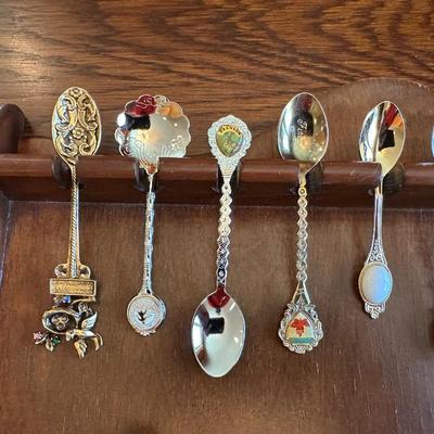 SOUVENIR SPOONS AND A WALL HUNG HOLDER