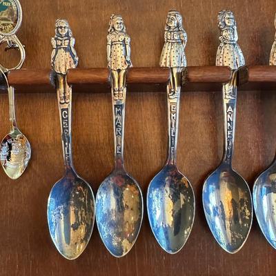SOUVENIR SPOONS AND A WALL HUNG HOLDER