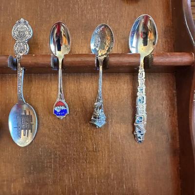 SOUVENIR SPOONS AND A WALL HUNG HOLDER