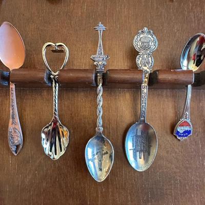 SOUVENIR SPOONS AND A WALL HUNG HOLDER