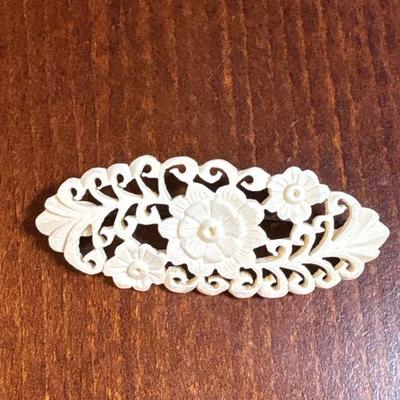 3 carved bone pins