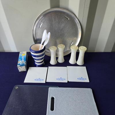 Sale Photo Thumbnail #85: Includes: 2 cutting boards
3 blue cornflower trivets(2 chipped)
Garlic press
2-Tupperware Salt & Pepper sets
Utensil holder
Pizza pan