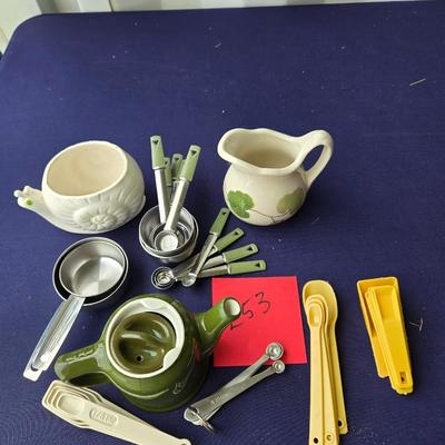 Sale Photo Thumbnail #91: Vintage neasuring cups, spoons, syrup pitcher, teapot & snail planter
