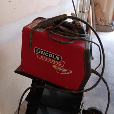 LINCOLN ELECTRIC WELD-PAK 100 WELDER ON A PORTABLE STAND
