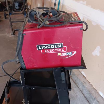 LINCOLN ELECTRIC WELD-PAK 100 WELDER ON A PORTABLE STAND